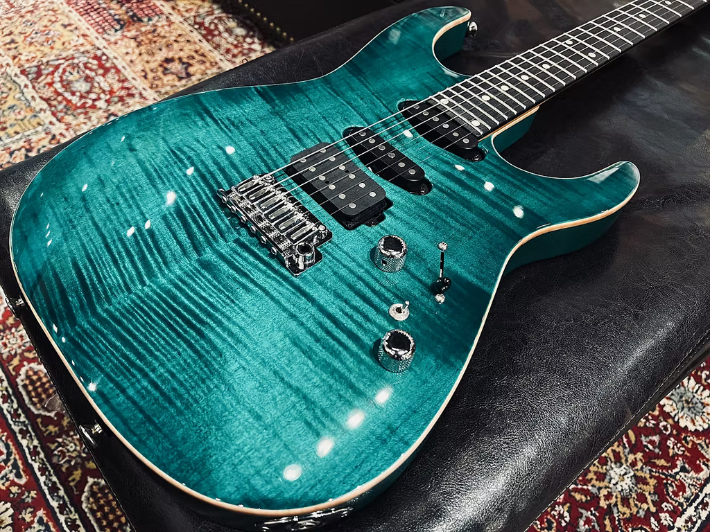 Tom Anderson Angel in Transparent Teal Burst with Binding
