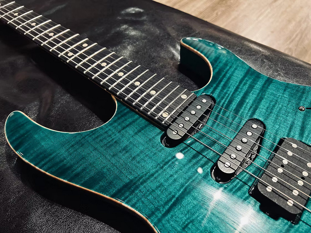 Tom Anderson Angel in Transparent Teal Burst with Binding