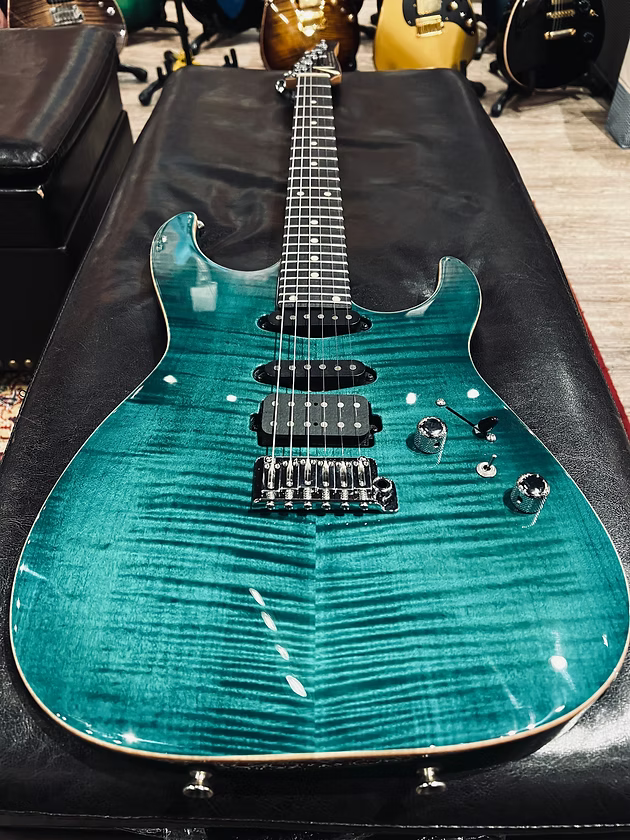 Tom Anderson Angel in Transparent Teal Burst with Binding