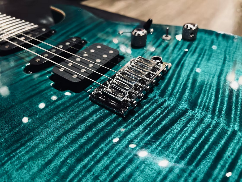 Tom Anderson Angel in Transparent Teal Burst with Binding