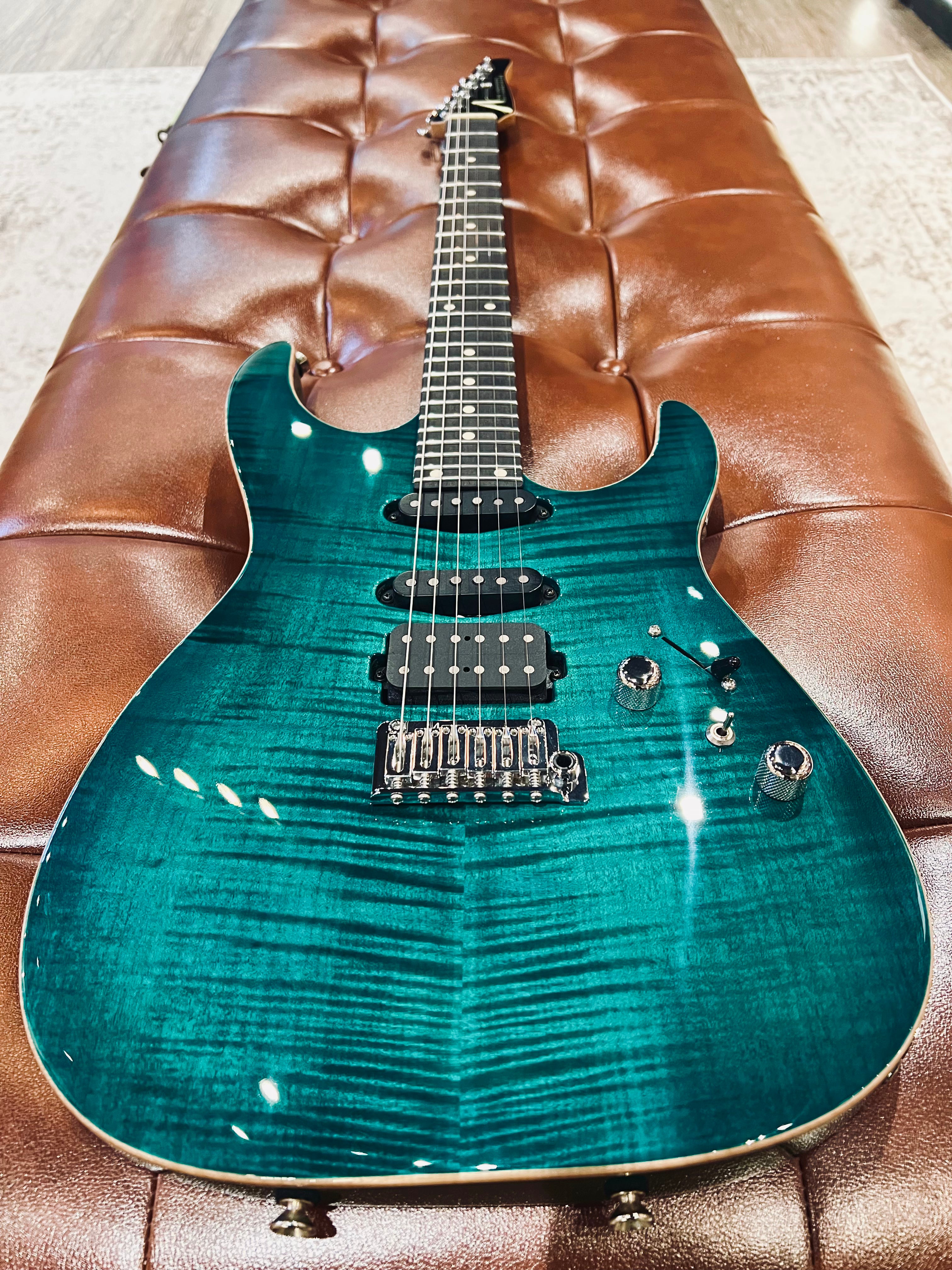 Tom Anderson Angel in Transparent Teal Burst with Binding